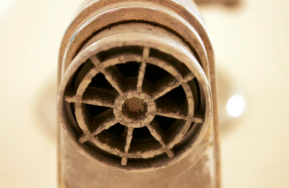 Hard water scale problem on a bathroom faucet before water softener service support